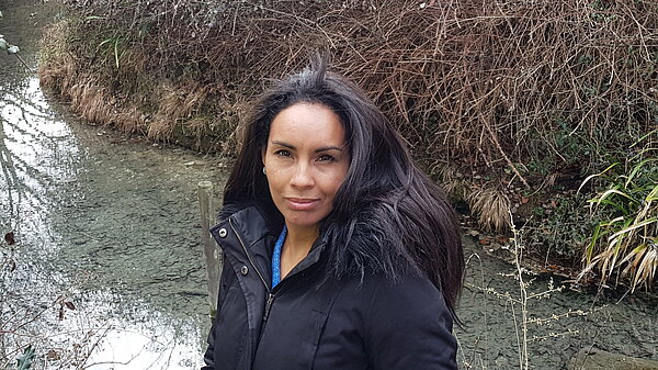 Ingrid in front of a stream in Trumpington