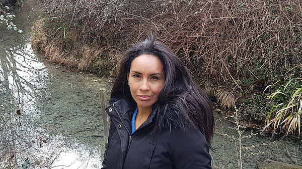 Ingrid in front of a stream in Trumpington